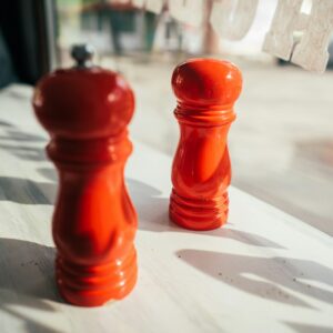 salt and pepper grinders on a table